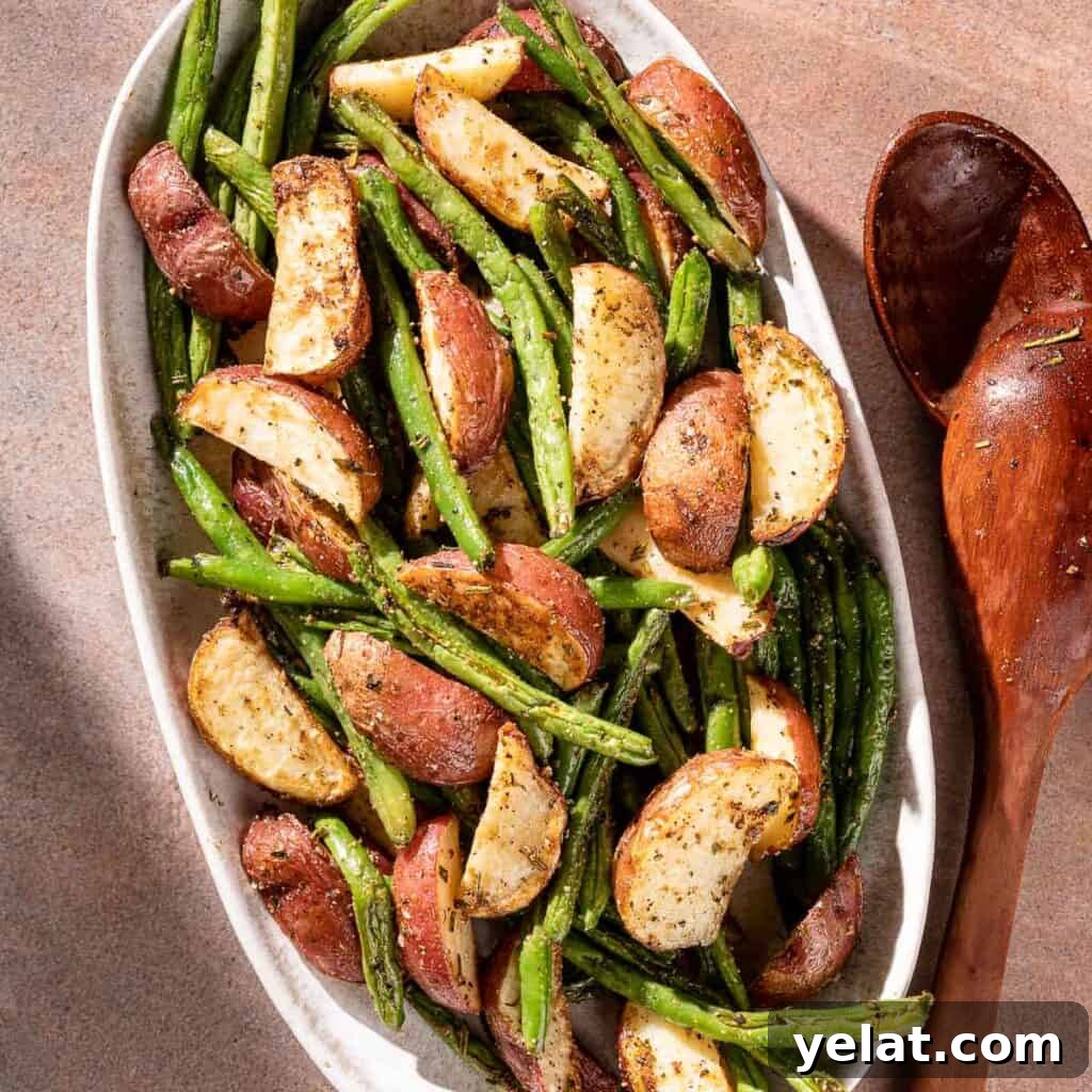 Maple-Glazed Roasted Squash and Apples for Fall Side Dish 14 potatoes and green beans on platter with serving spoon on the side