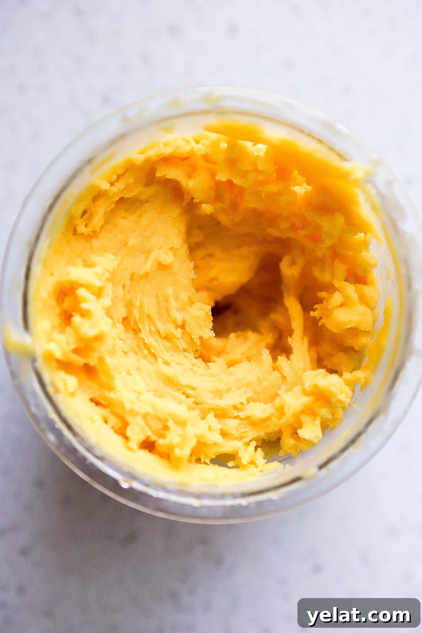 Ninja Creami Mango Sorbet: 3-Ingredient Dairy-Free Recipe 6 Top down view of a ninja creami pineapple sorbet recipe on kitchen counter.