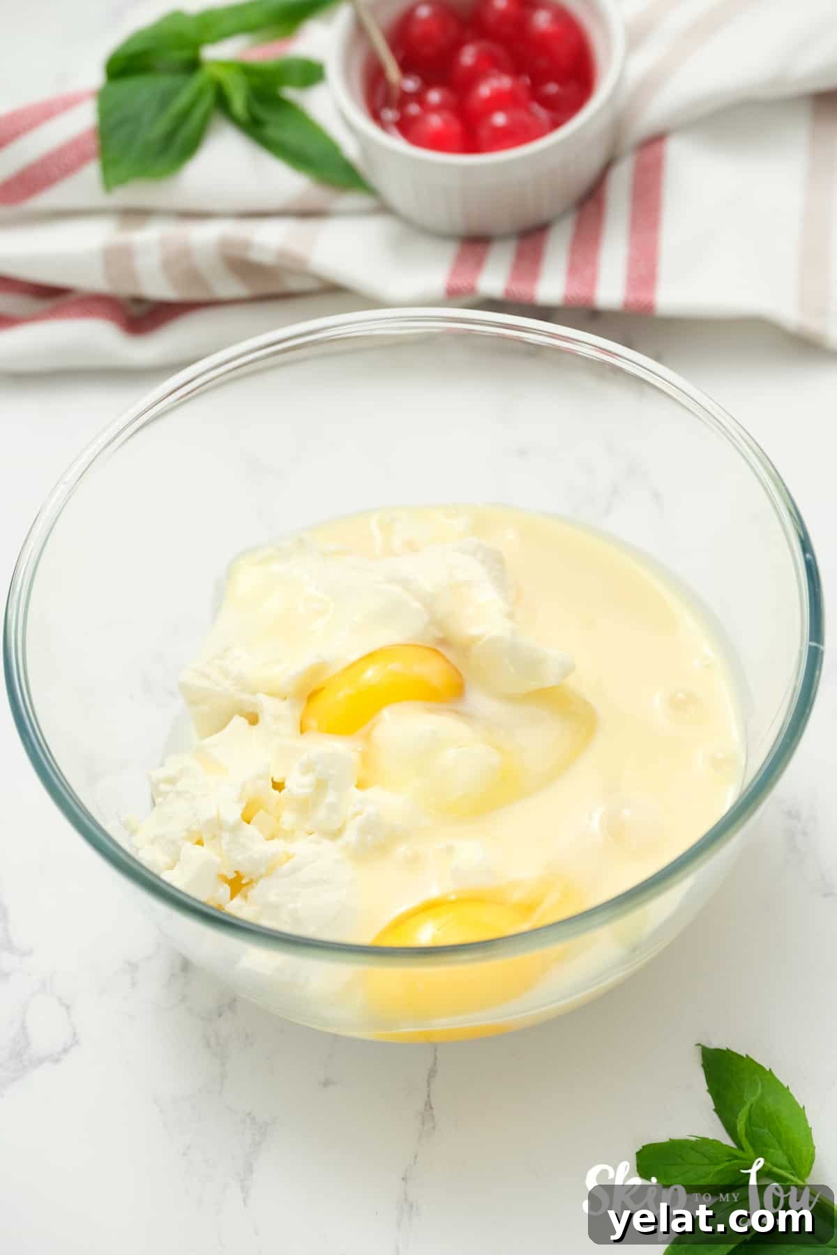 add eggs to the mix for the chocolate chip cookie cheese cakes