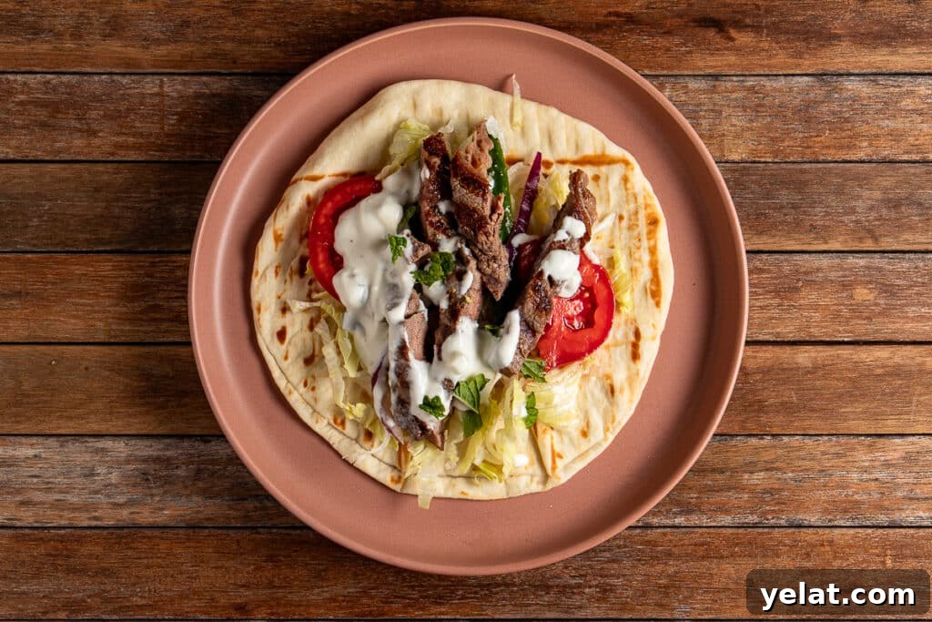 open souvlaki wrap on a plate