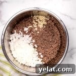 cooked ground beef with chopped onions and minced garlic in an instant pot