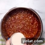 pouring masa harina and water over the chili