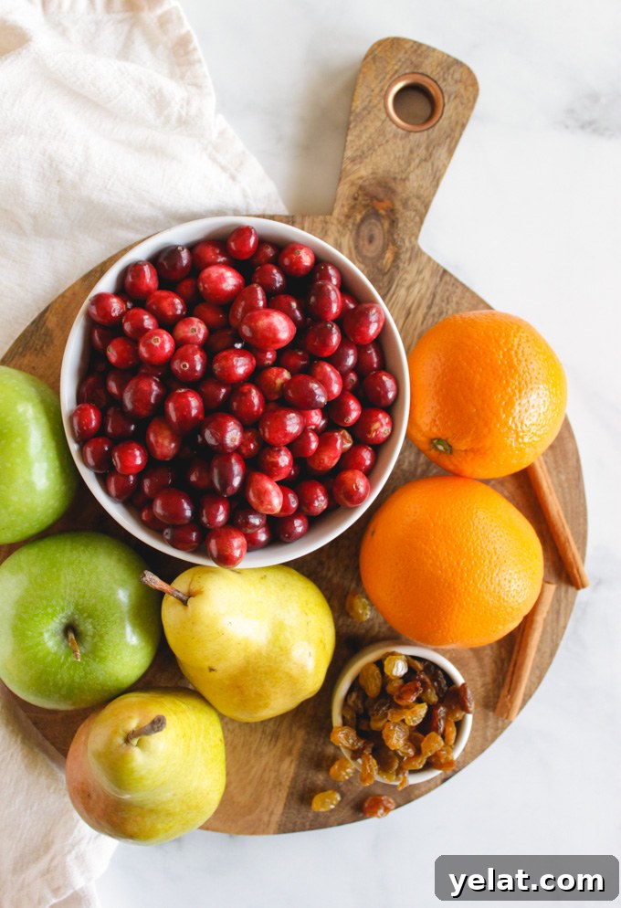 Favorite Cranberry Apple Pear Sauce - the perfect side dish for Thanksgiving or Christmas. It's packed with saucy cranberries, apples, pears, and sweet raisins. #Thanksgiving #recipes #vegan #glutenfree