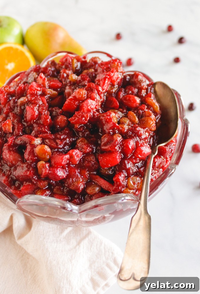 Favorite Cranberry Apple Pear Sauce - the perfect side dish for Thanksgiving or Christmas. It's packed with saucy cranberries, apples, pears, and sweet raisins. #Thanksgiving #recipes #vegan #glutenfree