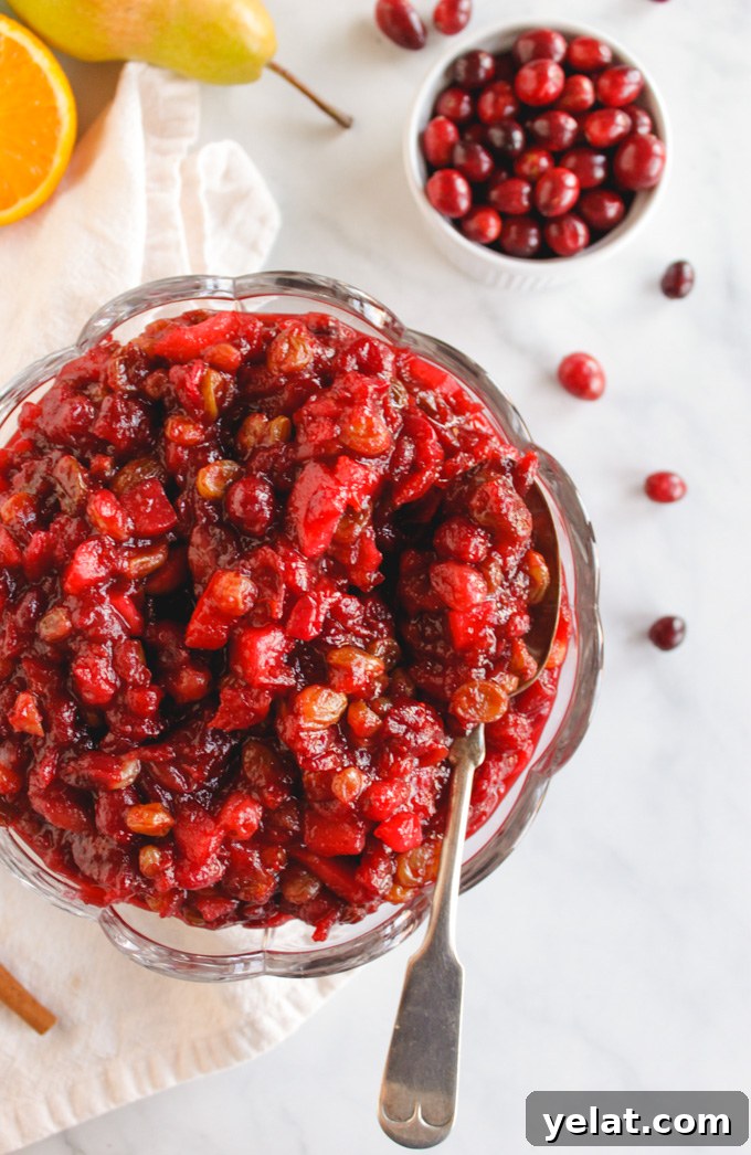 Favorite Cranberry Apple Pear Sauce - the perfect side dish for Thanksgiving or Christmas. It's packed with saucy cranberries, apples, pears, and sweet raisins. #Thanksgiving #recipes #vegan #glutenfree