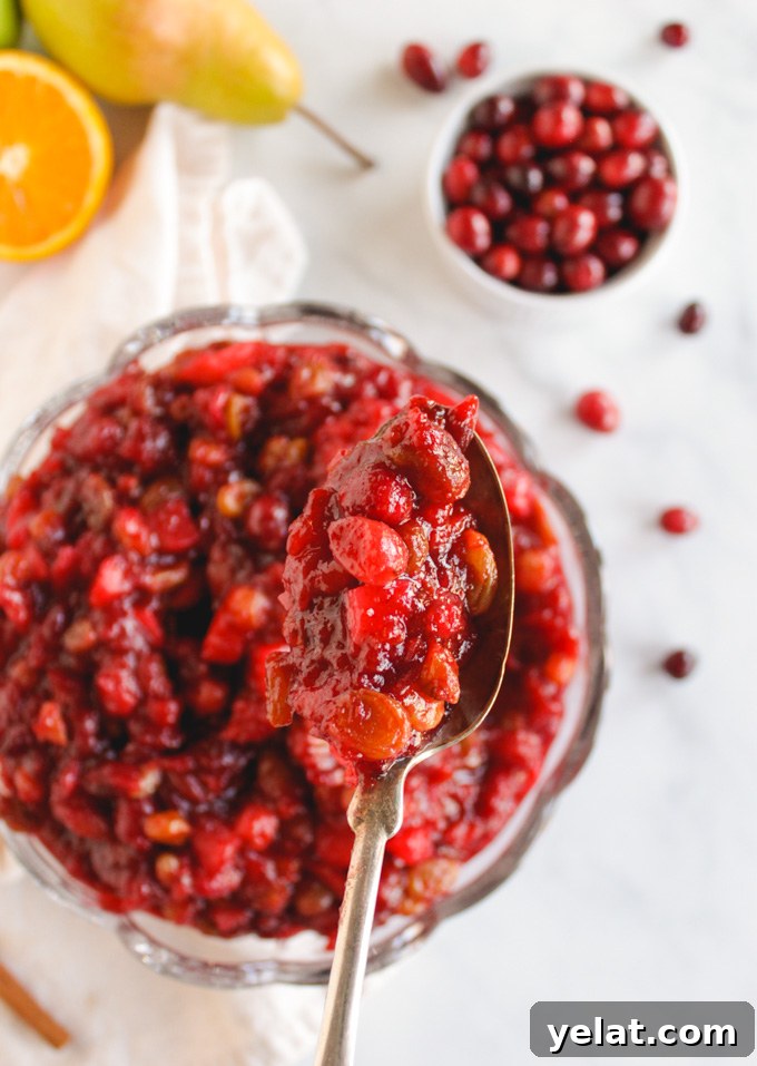 Favorite Cranberry Apple Pear Sauce - the perfect side dish for Thanksgiving or Christmas. It's packed with saucy cranberries, apples, pears, and sweet raisins. #Thanksgiving #recipes #vegan #glutenfree