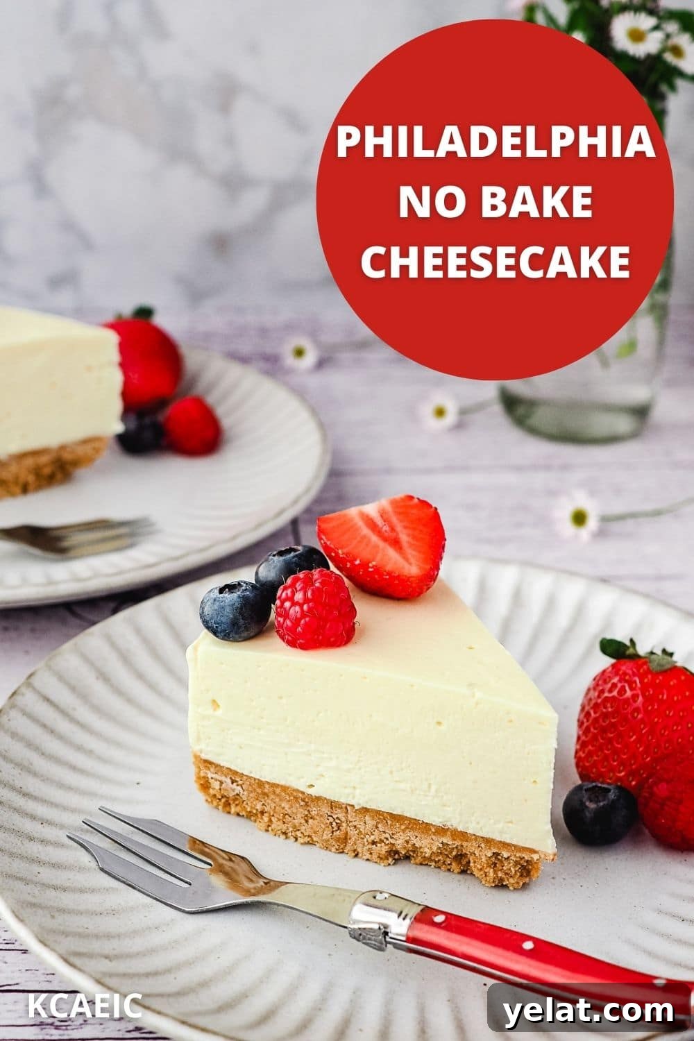 Philadelphia No-Bake Cheesecake Recipe — Creamy, Refrigerator Cheesecake 12 Slice of cheesecake on a plate with fresh berries, with another slice of cheesecake and small vase of flowers in the background, with text overlay.