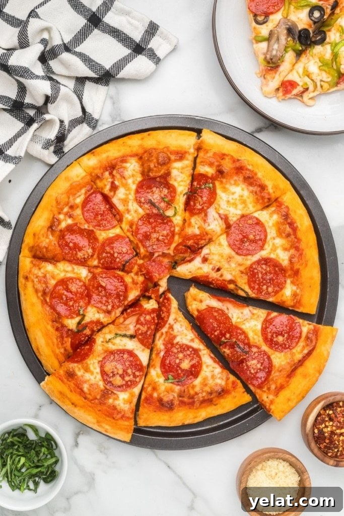 A homemade pizza served in a round pan with bowls of seasonings.