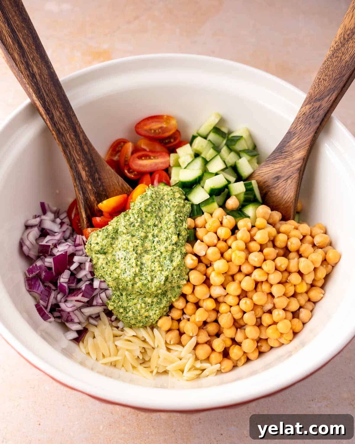 Chickpea Orzo Salad with Basil Pesto Dressing 5 Pesto Orzo Salad ingredients in mixing bowl.