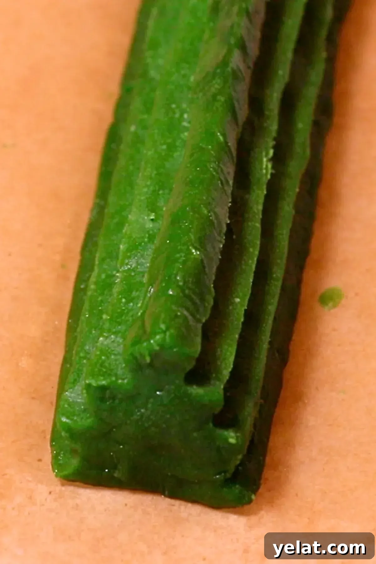 Slice-and-Bake Christmas Cookies: Tree, Reindeer & Gift Box Ideas 9 green cookie dough curved into a Christmas tree shape