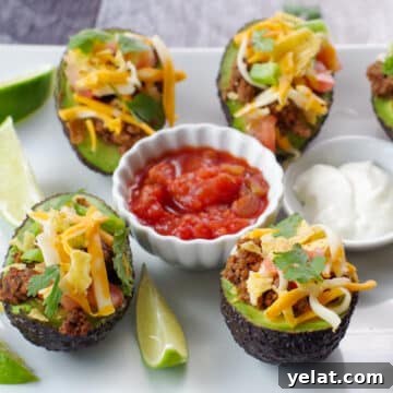 Comforting Recipes for Everyday Wellness and Flavor 7 a white tray of avocado tacos with salsa and sour cream in the middle and lime wedges on the side