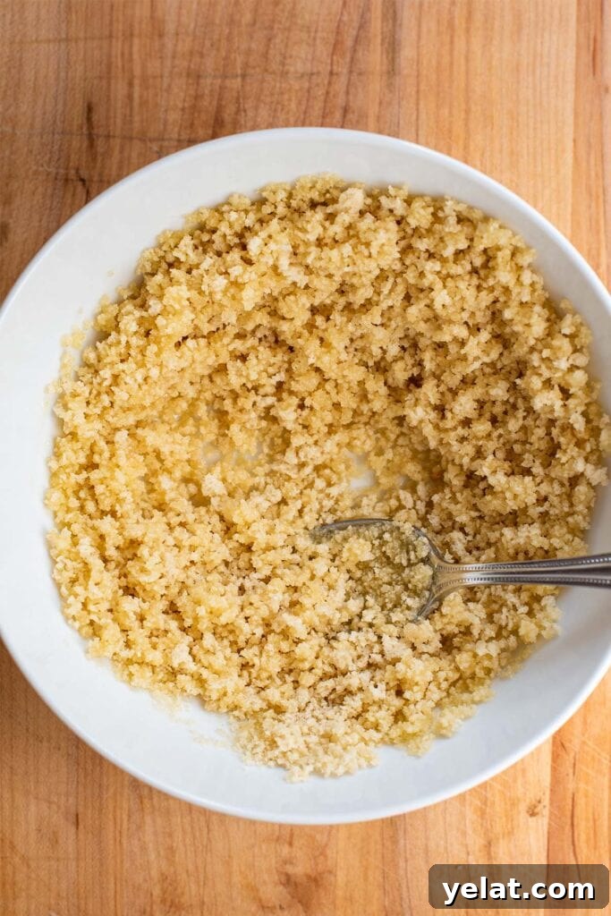 Skillet Buffalo Chicken Macaroni and Cheese Recipe 19 Melted butter and golden panko crumbs in a small white bowl.