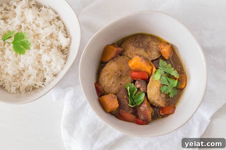 a large bowl of plantain curry next to a large bowl of white rice