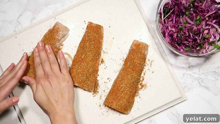 rubbing homemade blackened seasoning on the mahi-mahi