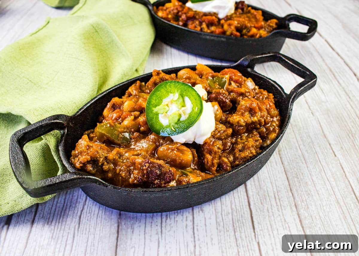 Over the Top Chili in a black cast iron bowl.