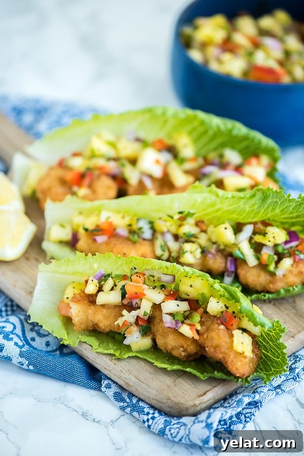Shrimp Lettuce Wraps topped with pineapple salsa – a quick, easy and low carb meal.