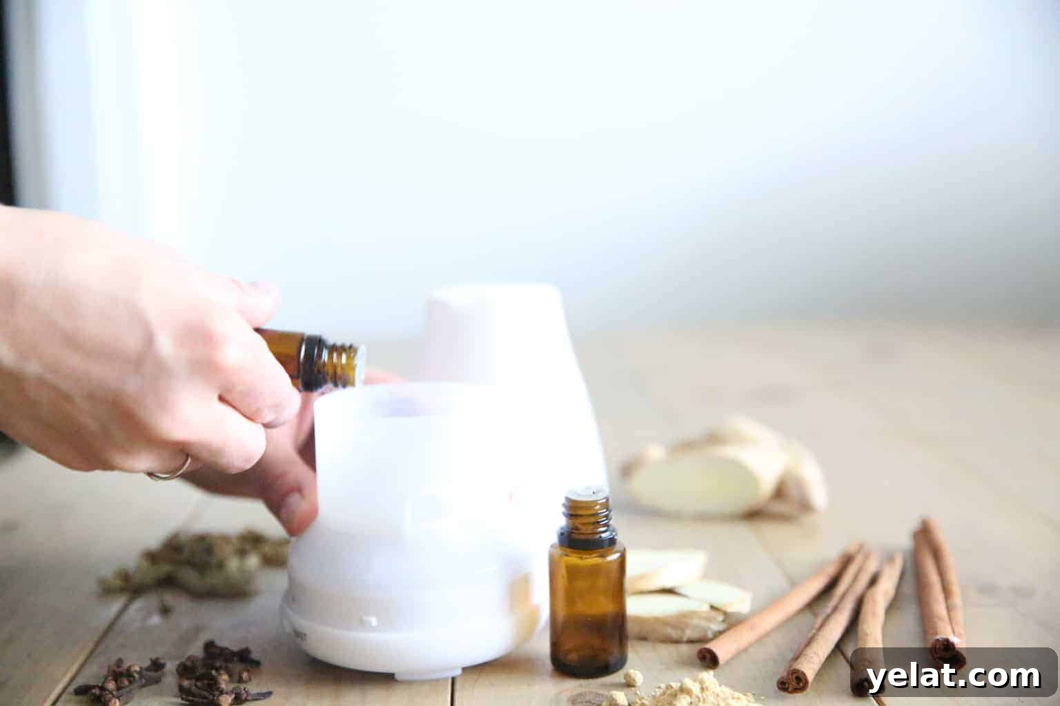 adding ginger essential oil to a small diffuser