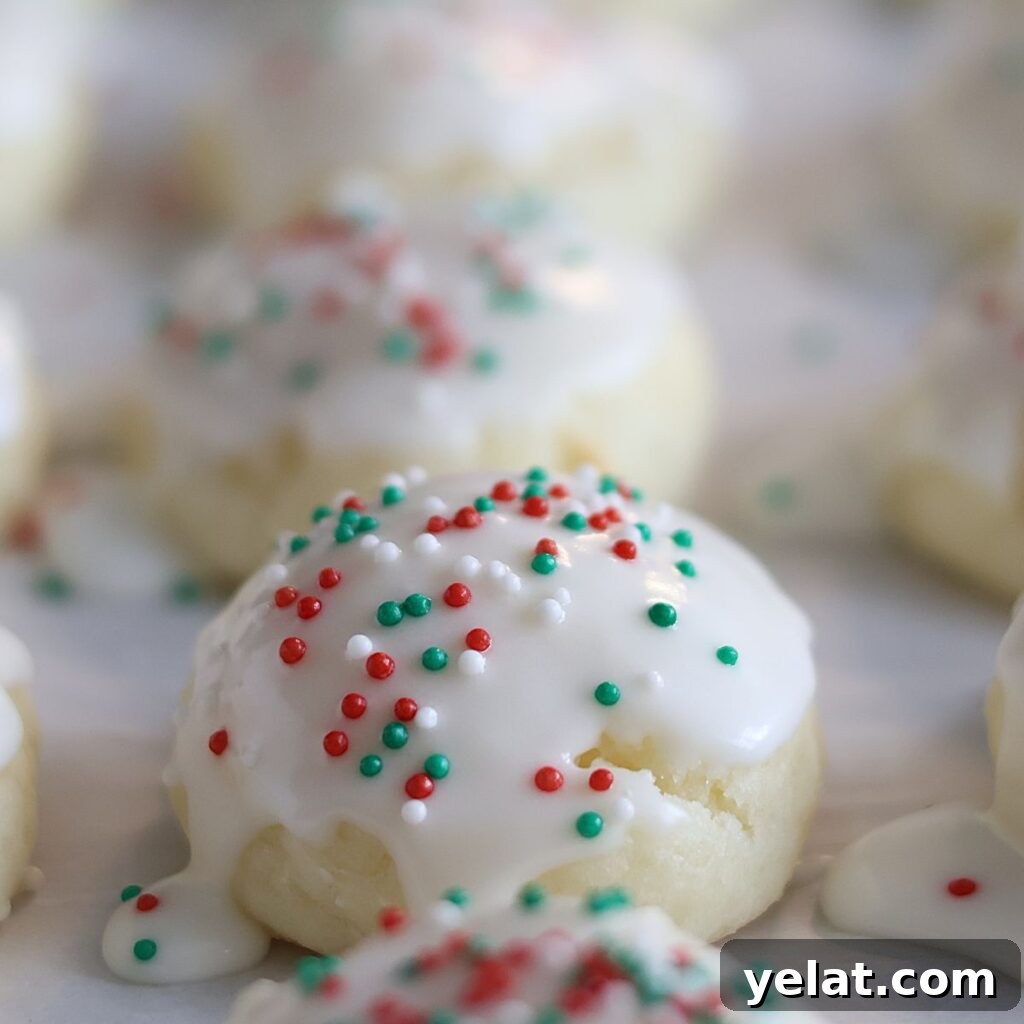 Irresistible Gluten-Free Ricotta Cookie Recipe 2 close up of ricotta cookies on parchment paper.