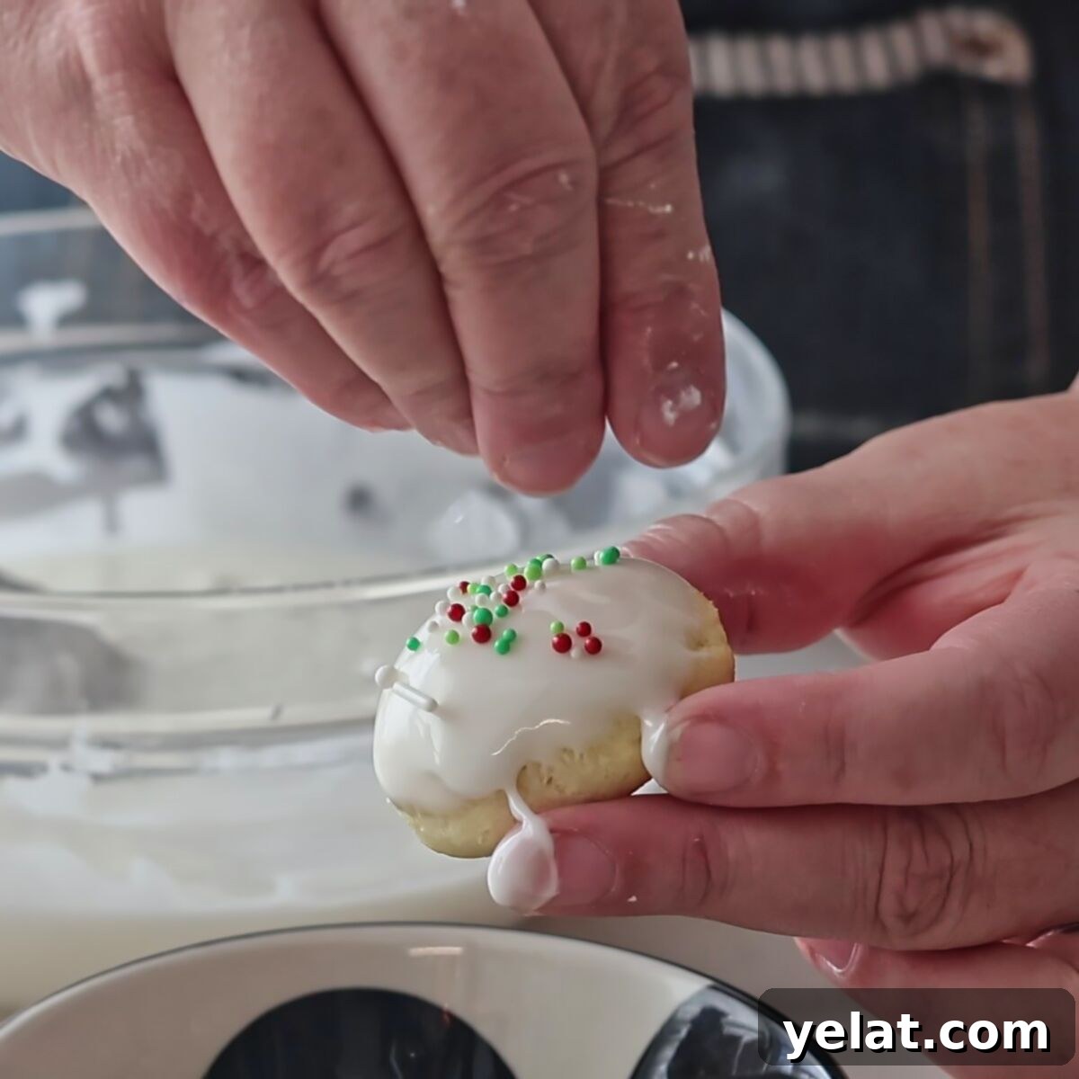 Irresistible Gluten-Free Ricotta Cookie Recipe 12 adding sprinkles on top of a white iced cookie.