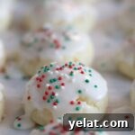 Irresistible Gluten-Free Ricotta Cookie Recipe 14 close up of ricotta cookies on parchment paper.