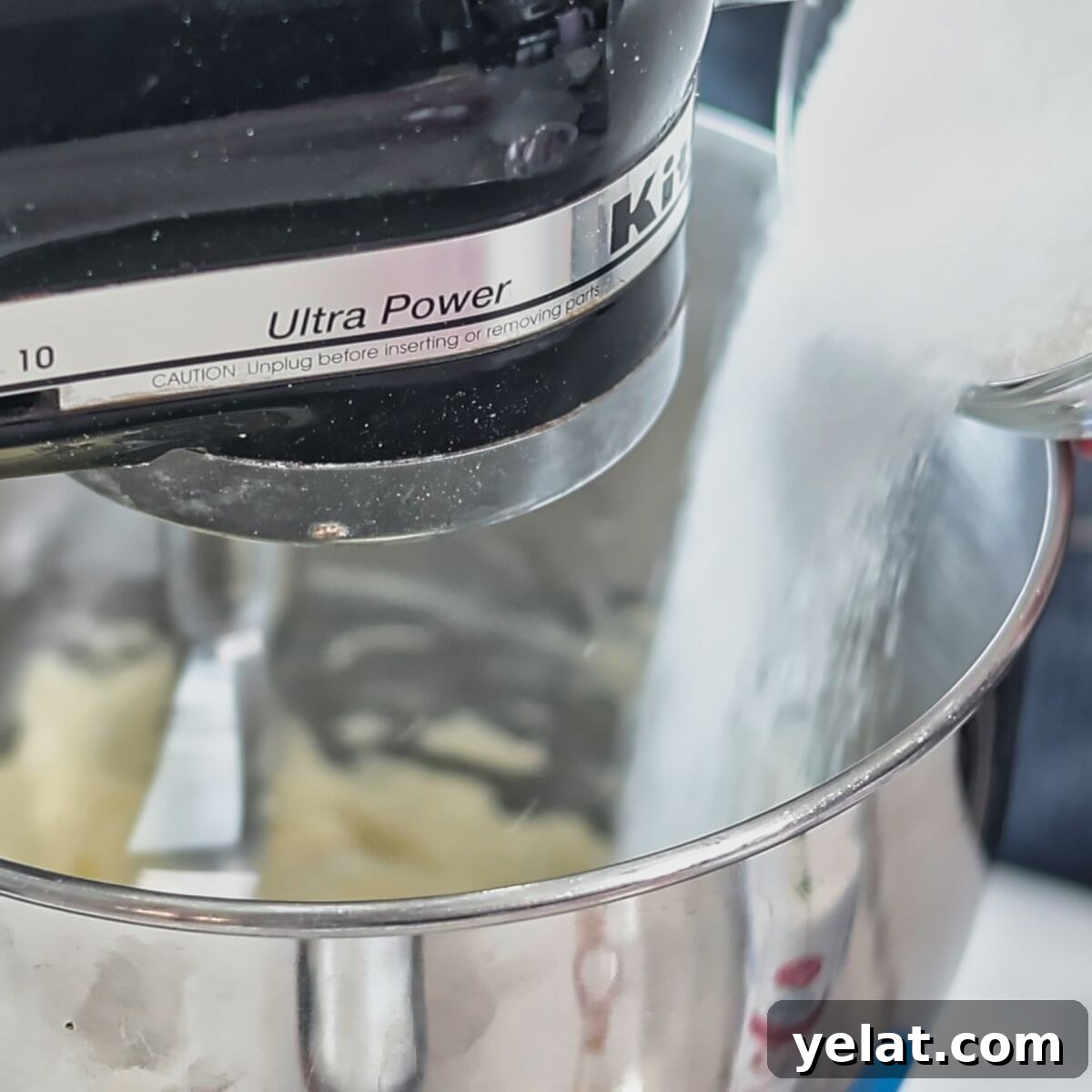 Irresistible Gluten-Free Ricotta Cookie Recipe 5 pouring sugar into bowl of stand mixer.