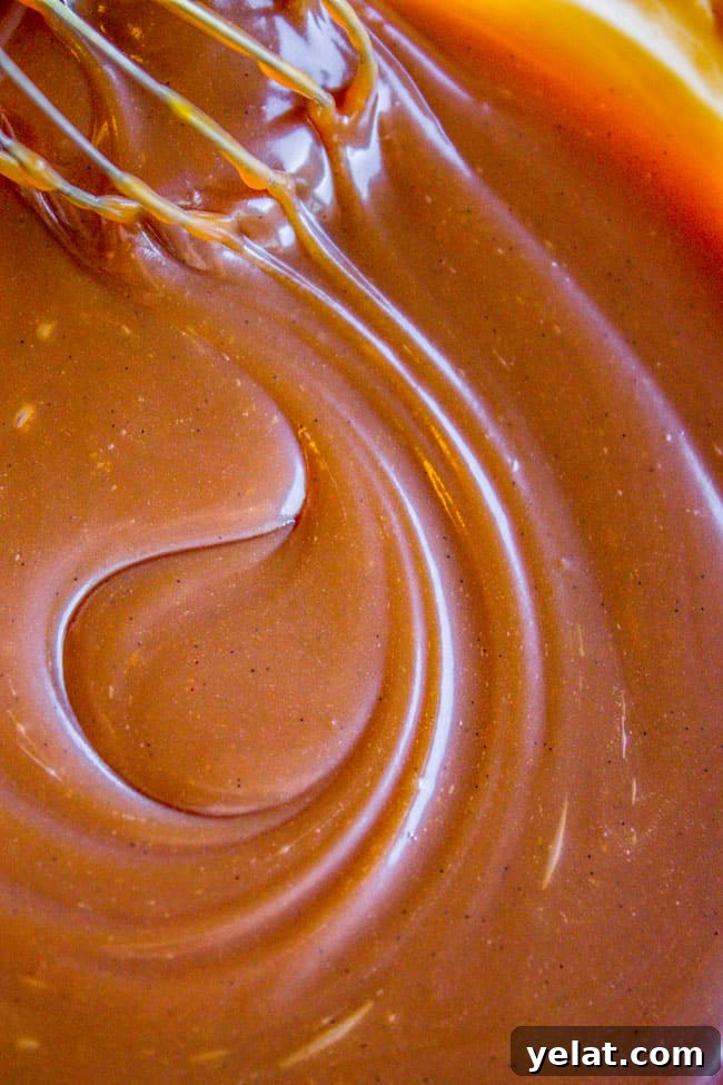 Homemade Caramel Sauce Recipe for Rich, Smooth Results 6 stirring thick caramel sauce with a whisk.