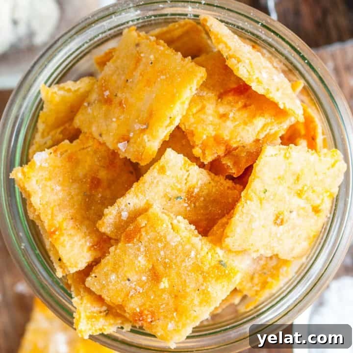 Close up view of cheddar ranch sourdough discard crackers in a jar.