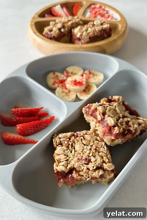 Raspberry White Chocolate Blondies Recipe — Chewy Berry Bars 9 Strawberry crumble bars served with bananas, strawberries, and yogurt.