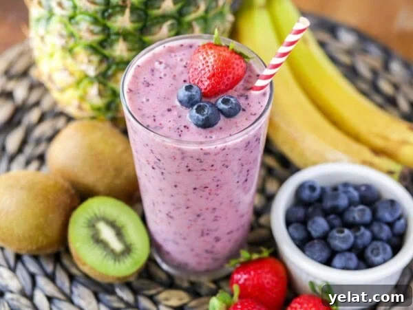 Authentic Mexican Chilaquiles Recipe: Classic Red and Green Variations 11 A blend fresh fruit smoothie in a glass surrounded by fruit.