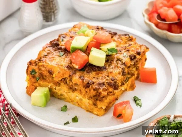 Authentic Mexican Chilaquiles Recipe: Classic Red and Green Variations 15 Slice of Mexican Breakfast Casserole served on white plate.