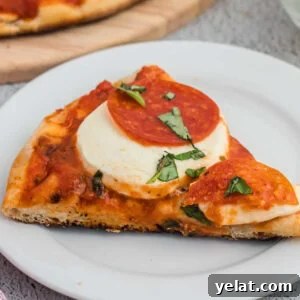 How to Make Perfect Calzones on a Blackstone Griddle 13 Crispy pepperoni pizza with melted cheese and fresh basil on white plate