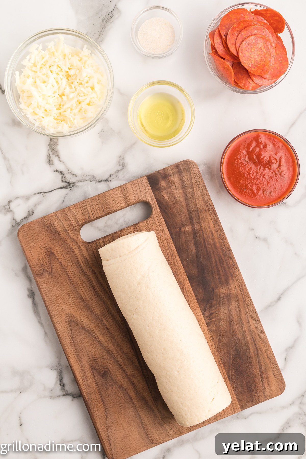 How to Make Perfect Calzones on a Blackstone Griddle 3 Ingredients needed, pizza dough, pizza sauce, mozzarella cheese, pepperoni, oil, garlic salt