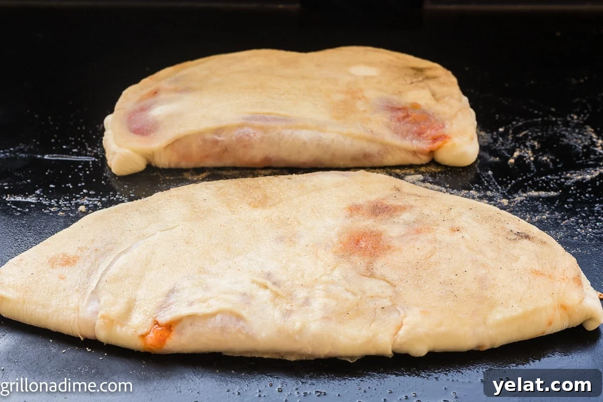 How to Make Perfect Calzones on a Blackstone Griddle 7 Cooked calzone on the griddle