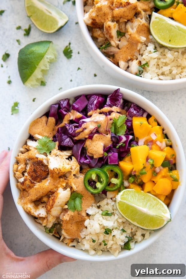 taco bowl overhead shot of a paleo whole30 fish taco bowl drizzled with chipotle mayo