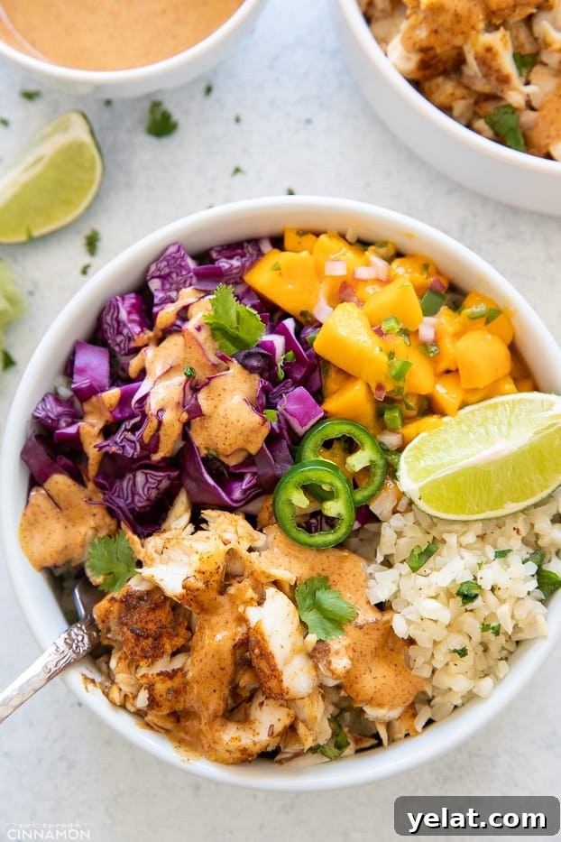 taco bowl overhead shot of a healthy whole30 fish taco bowl with cauliflower rice and chipotle mayo