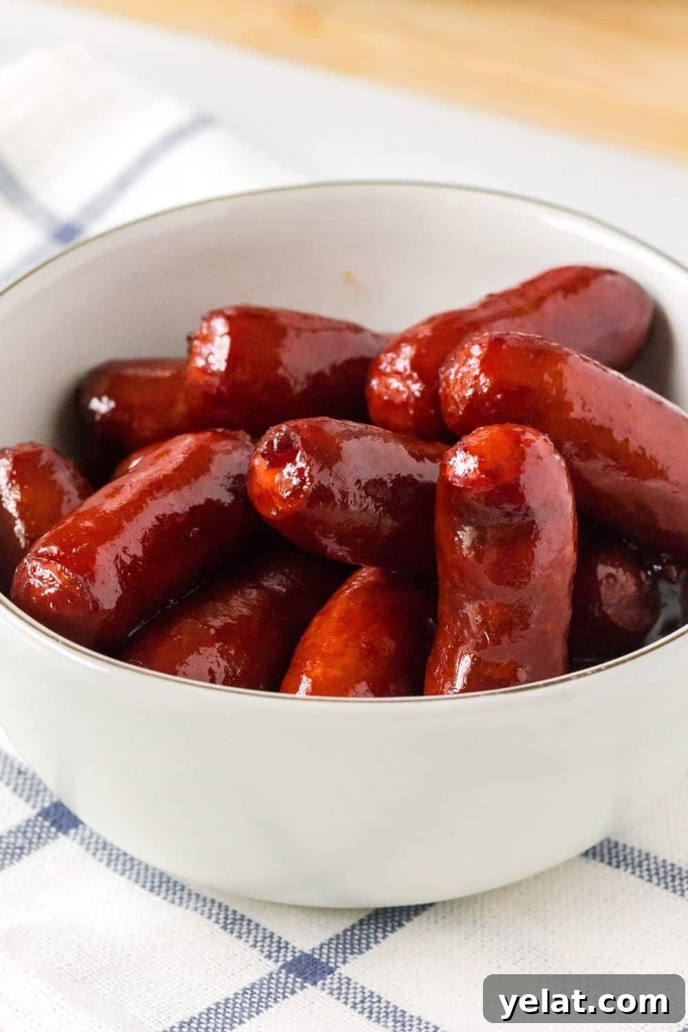 pressure cooker little smokies served in a small ceramic bowl