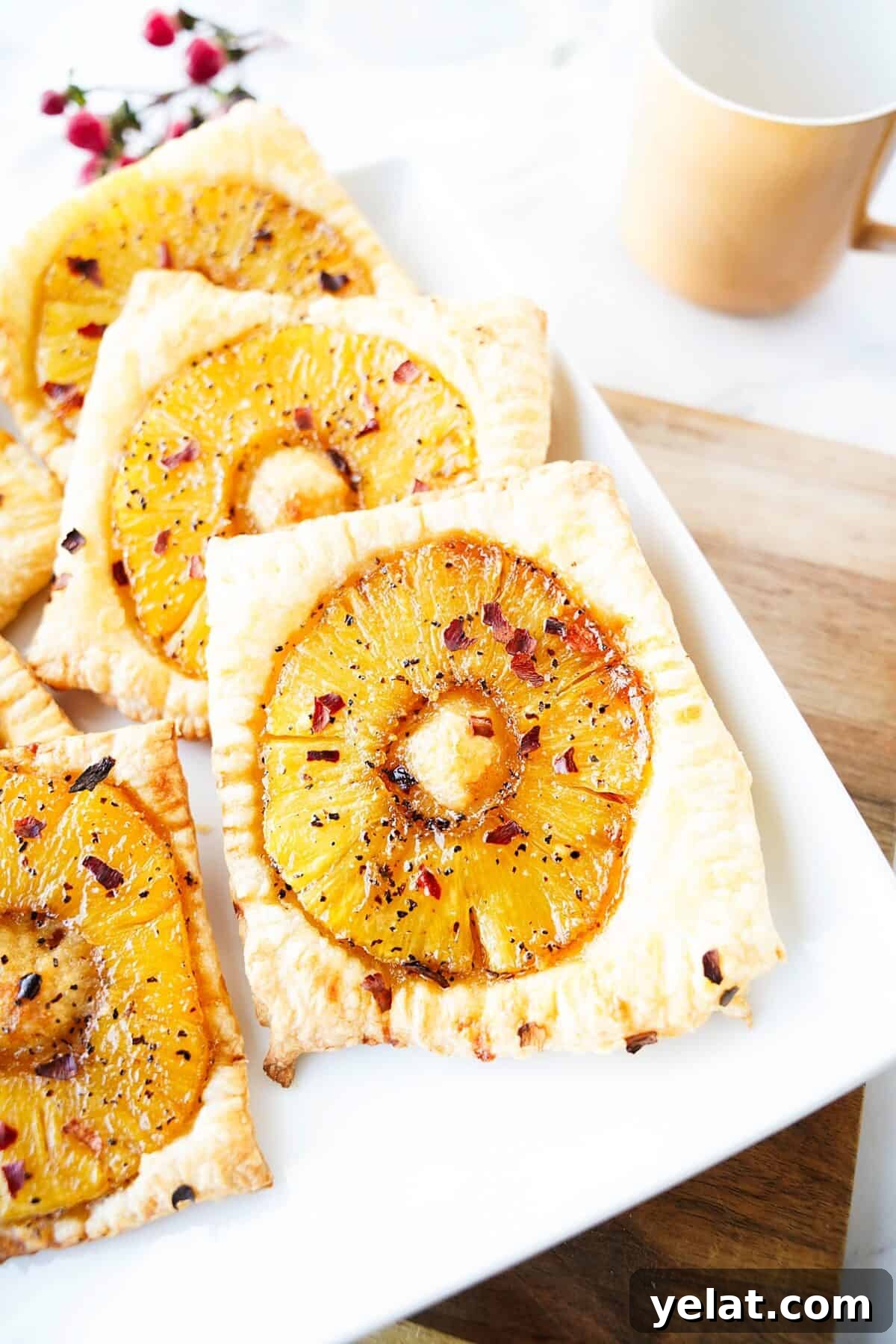 Spicy Pineapple Tart Recipe: Sweet and Tangy Baked Cookies 3 close up vertical shot of spicy pineapple tart on white square plate