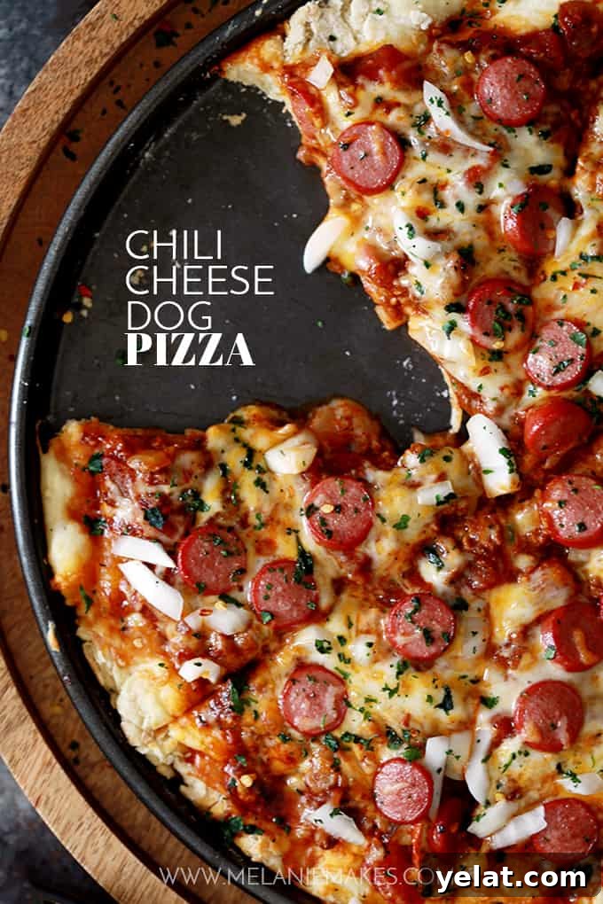 Chili Cheese Dog Pizza on a cutting board, ready to serve. Chili Cheese Dog Pizza on a cutting board, ready to serve.