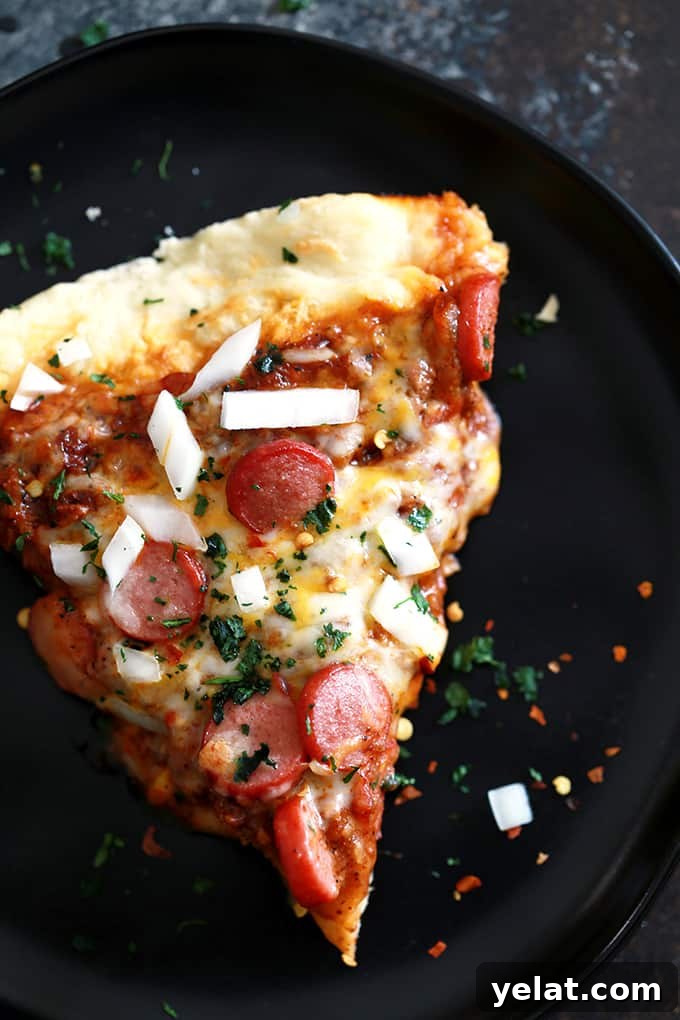 Close up of melted cheese and chili on pizza crust. Close up of melted cheese and chili on pizza crust.