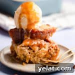 Self-Saucing Banana Pudding Recipe with Gooey Caramel Sauce 12 straight ahead super close up at banana pudding with scoop of ice cream on top