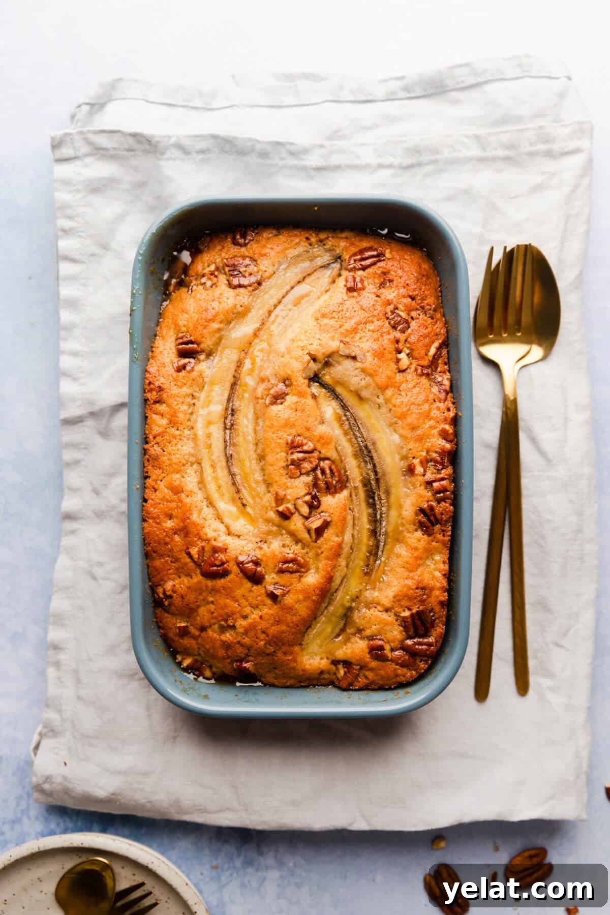 Self-Saucing Banana Pudding Recipe with Gooey Caramel Sauce 3 overhead shot of self saucing banana pudding topped with sliced banana and pecans