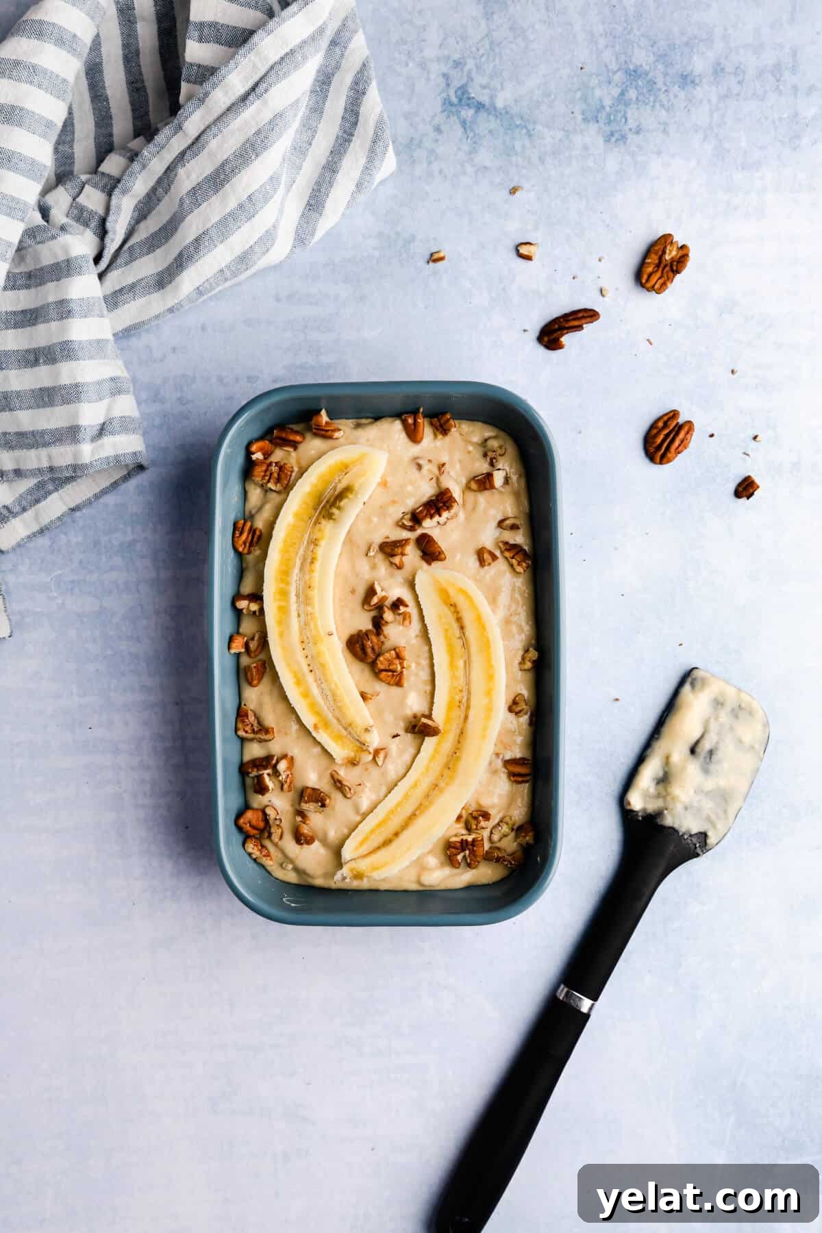 Self-Saucing Banana Pudding Recipe with Gooey Caramel Sauce 7 top view of a small rectangular baking dish with batter inside