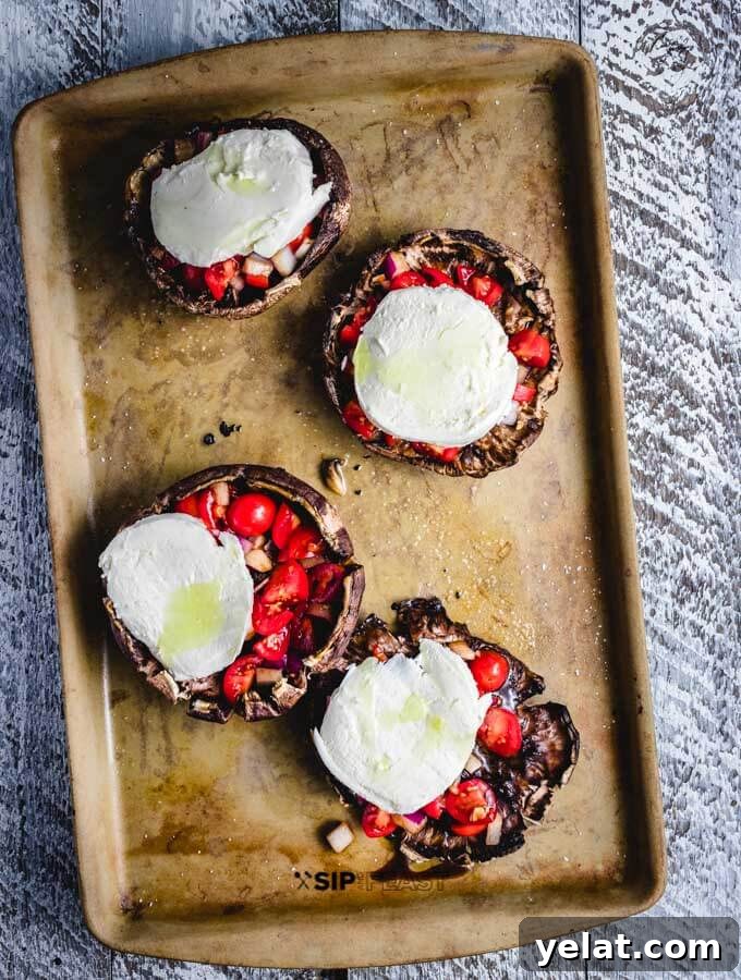 Portobellos topped with mozzarella Portobellos topped with fresh mozzarella.