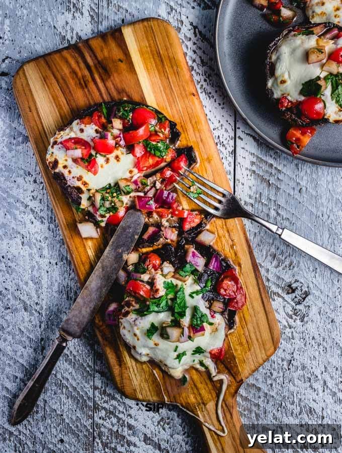 Finished baked portobello mushrooms baked stuffed portobello mushrooms with the bruschetta and mozzarella final image.