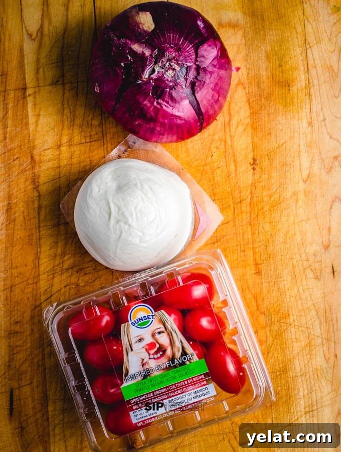 Fresh mozzarella and tomatoes Fresh mozzarella, cherry tomatoes and 1 red onion.