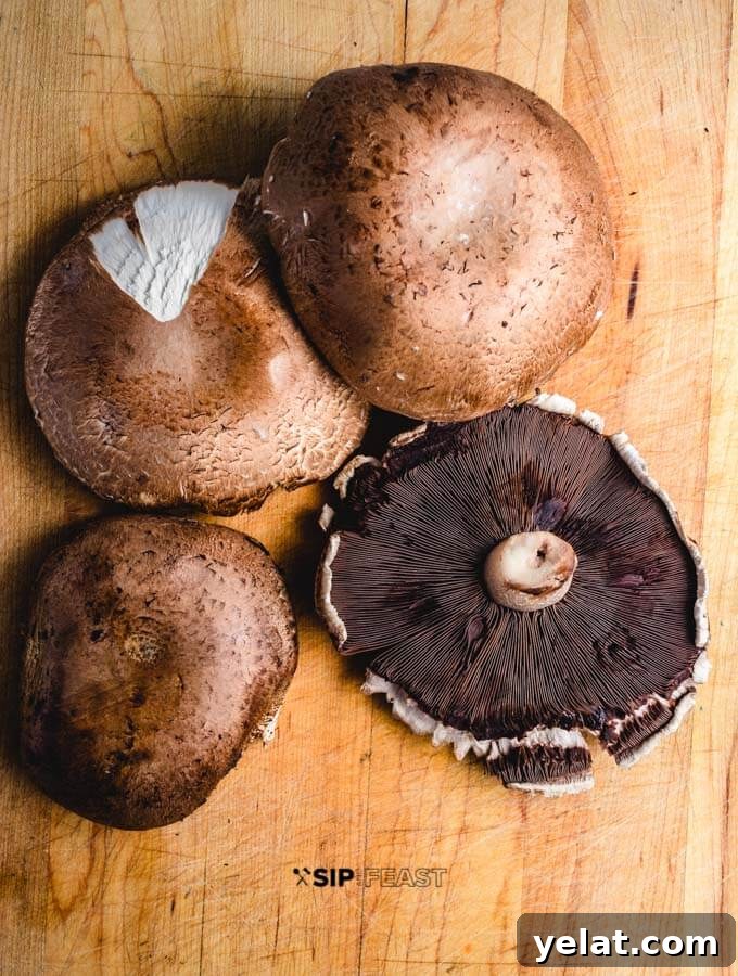 Portobello mushrooms Portobello mushrooms on cutting board.