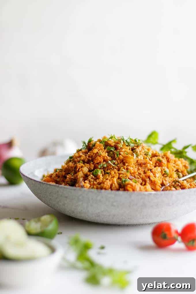 Authentic Mexican Cauliflower Rice Recipe for Flavorful Low-Carb Meals 2 A side view of a bowl filled high with low carb cauliflower mexican rice.