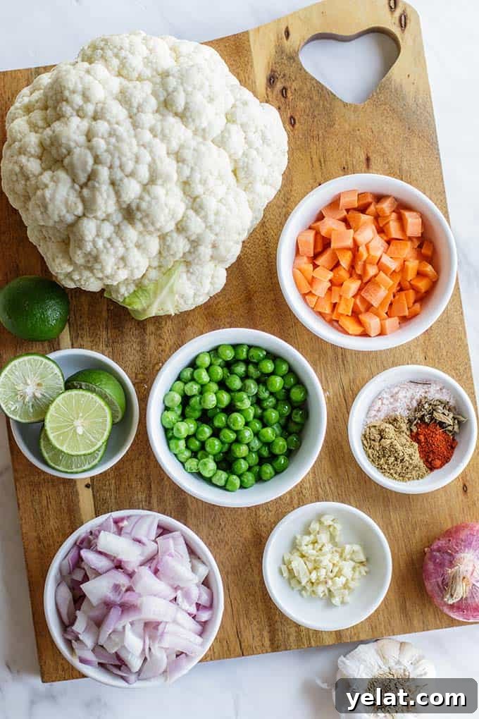 Authentic Mexican Cauliflower Rice Recipe for Flavorful Low-Carb Meals 3 A cutting board with all the ingredients for cauliflower Mexican rice dish prepared.