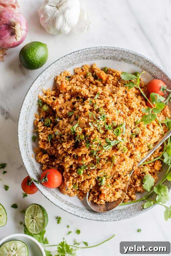 Authentic Mexican Cauliflower Rice Recipe for Flavorful Low-Carb Meals 5 A top view of a bowl piled high with low carb mexican rice.