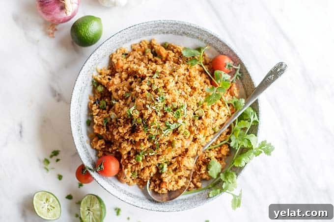 Authentic Mexican Cauliflower Rice Recipe for Flavorful Low-Carb Meals 7 A top view of a bowl piled high with low carb whole30 mexican rice.